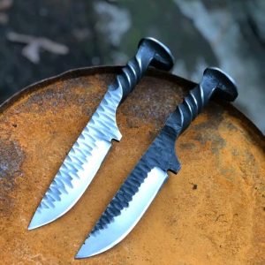 Custom knife made from a light-gauge rail spike.  Spike head is formed into a skull.  Overall length: 5".  Blade length: 4". Overall length 9"