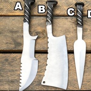 Custom knives set made from a light-gauge rail spike.  Spike head is formed into a skull.  Overall length: 10".  Blade length: 4.5".  Handmade leather sheath.