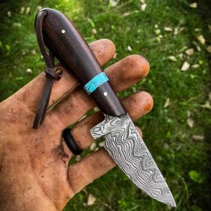 Custom hand made Damascus steel cowboy skinner knife .